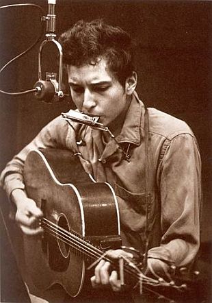 Bob Dylan at work making music and poetry in 1962.