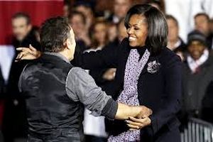Bruce Springsteen greeting First Lady Michelle Obama at campaign rally in Des Moines, Iowa, Nov. 5, 2012.