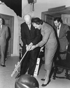 President Eisenhower getting golf tips from Babe Didrikson at the White House, April 1, 1954, as the president uses the American Cancer Society’s "Sword of Hope" for a substitute golf club. Babe had presented the Sword to the president after he opened the 1954 Cancer Crusade, then lighting a huge "Sword of Hope" in New York's Times Square by remote control. AP photo.