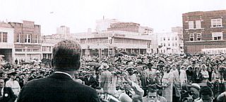 JFK looking out over crowd and downtown Fort Worth, Texas during speech on the morning of November 22, 1963.