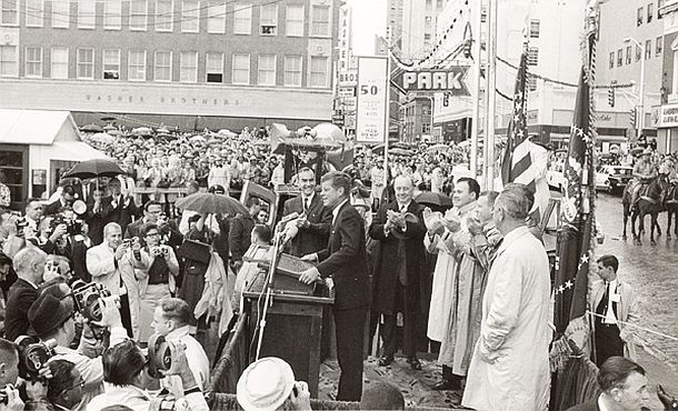 Fort Worth, Texas: At approximately 8:45a.m. on the morning of November 22, 1963, President John F. Kennedy delivered a short speech to thousands of Texans in downtown Fort Worth prior to his formal speech inside the Texas Hotel before the Fort Worth Chamber of Commerce.  Rep. Jim Wright is standing just beyond JFK.