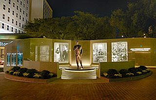 JFK Tribute Site  with night lighting, located near the Fort Worth Hilton Hotel (formerly, the Hotel Texas in 1963).