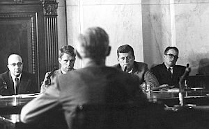 1957: Robert and John F. Kennedy (center) questioning witness at Senate Rackets Committee hearings.