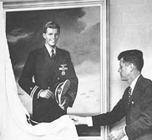 October 2, 1958: Senator  Kennedy unveiling a portrait of his brother at dedication of Lt. Joseph P. Kennedy, Jr. Memorial Science Hall, Assumption College.