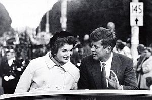 1958: JFK & Jackie riding in car during campaign event & parade in Boston. Photo, Carl Mydans.