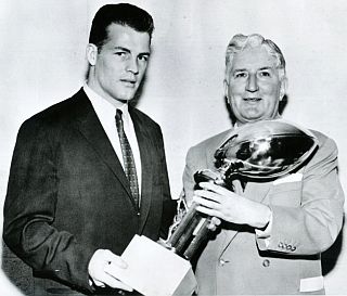 Frank Gifford receiving the NFL’s MVP trophy for 1956.