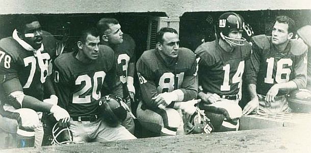 Early 1960s photo of New York Giants players in sideline dugout, believed to be, from left: Lane Howell (No. 78), Jimmy Patton (No. 20), Andy Robustelli (No. 81), Y.A. Tittle (No. 14), and Frank Gifford ( No. 16).