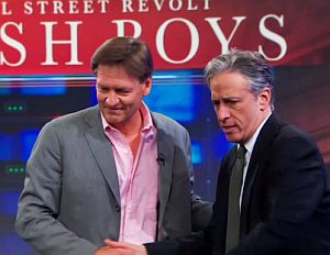 Michael Lewis with Jon Stewart during his April 2014 appearance on the Daily Show to discuss “Flash Boys.”