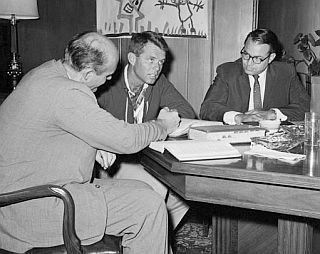 Attorney General Robert F. Kennedy, center, conferring with Justice Department assistants, Nicholas B. Katzenbach, left, and Herbert J. Miller, during the May 1961 Freedom Rides.