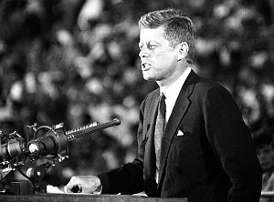 July 15, 1960: JFK at the Los Angeles Coliseum speaking before some 52,000 and another 35 million on television. “Today our concern must be with [the] future.... The old era is ending. The old ways will not do…. We stand today on the edge of a New Frontier… ”