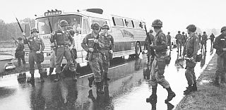 May 24, 1961: Alabama National Guard protecting Freedom Ride bus at stop near Mississippi handover, at state border.