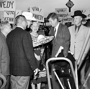 April 1960: As JFK stepped off his campaign plane at the Tucson Arizona Municipal Airport, he was greeted by about 150 supporters, some waving “Viva! Kennedy” placards. He was also given a sombrero and a cowboy hat. Photo, Tucson Citizen.