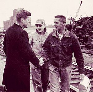 March 30, 1960: Campaigning early a.m. at the Manitowoc Shipyards in Wisconsin, JFK greets arriving workers and brothers, Ralph and Berlin Schroeder.