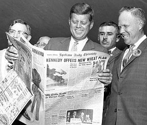 Sept 6, 1960: JFK in Spokane, WA reading about his proposed  “wheat plan” in the Spokane Daily Chronicle.