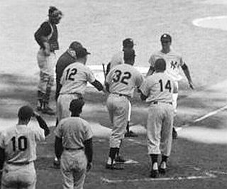Oct 8th, 1960, Game 3, Yankee Stadium: Bobby Richardson being greeted at home plate by Gil McDougald (12), Elston Howard (32) and Bill Skowron (14) for his first inning Grand Slam home run. Tony Kubek (10) was on deck.