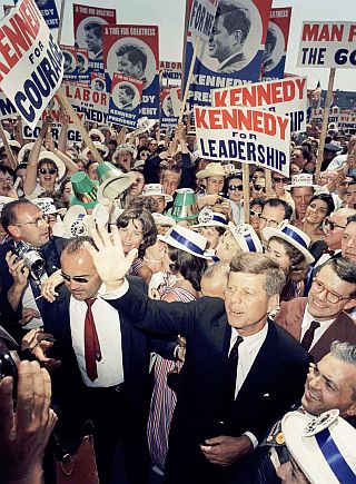 July 9, 1960: JFK makes his way through a crowd of supporters and journalists upon his arrival at the Democratic National Convention in Los Angeles.