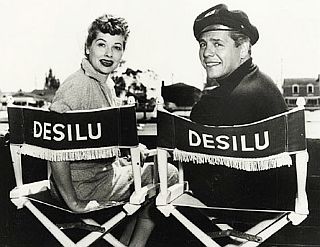 Lucille Ball and Desi Arnaz in their respective Desilu Studios directors chairs, circa 1950s.