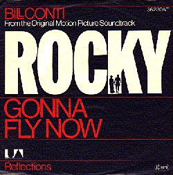 The single jacket cover for Bill Conti’s “Gonna‘ Fly Now,” with B-side “Reflections.” Click for digital.