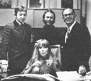 Joni Mitchell at Reprise contract signing, March 1968, with (l-to-r), Elliot Roberts, David Crosby, and Mo Ostin.