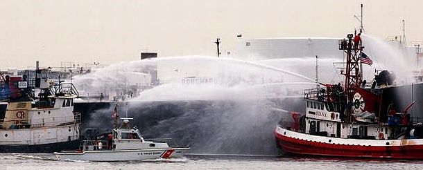 After being pulled from near the explosion area, fire boats proceeded to douse Bouchard Barge 35 with cool water, at it was also loaded with gasoline and fire officials feared it too would explode.