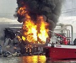 Burning wreckage of Bouchard Barge 125 after Feb 2003 explosion at ExxonMobil oil depot.