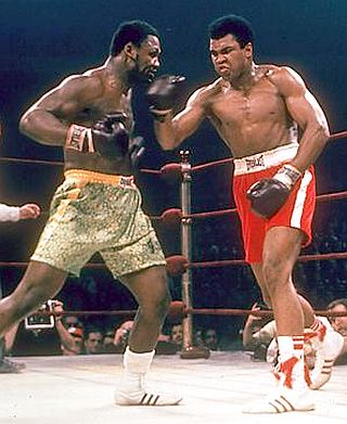March 1971: Joe Frazier (green trunks) and  Muhammad Ali (red trunks), square off in the big fight.