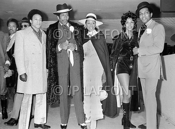 Photograph by famous New York photojournalist Jean-Pierre Laffont, capturing the style and high fashion of some of those attending the Joe Frazier-Muhammad Ali championship fight at Madison Square Garden, NY, March 8, 1971.