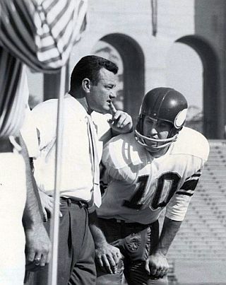 Coach Norm Van Brocklin of the Minnesota Vikings conferring with his quarterback, Fran Tarkenton, 1961, L.A. Coliseum.