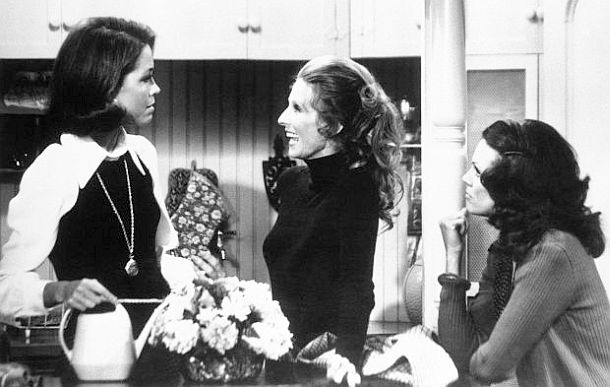 Mary Richards (Mary Tyler Moore), Phyllis Lindstrom (Cloris Leachman), and Rhoda Morgenstern (Valerie Harper), at Mary’s apartment in a scene from the 1970s TV sitcom, “The Mary Tyler Moore Show.”