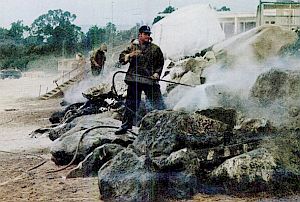 1969: Life magazine photo of workers steam-cleaning oil stained rocks at Carpinteria, CA.