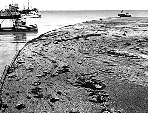 1969: Early attempts to corral the Santa Barbara oil spill using boats and oil booms.