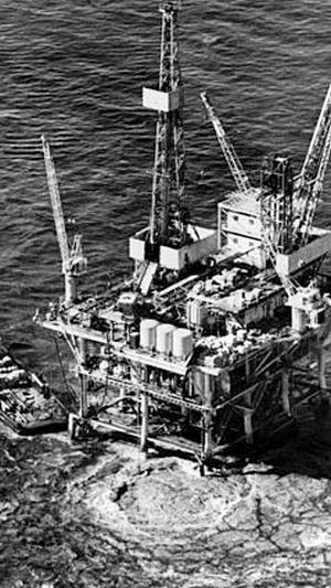 1969: Close up of Union Oil rig and the roiling surface waters from escaping oil & gas on the sea-bed below.
