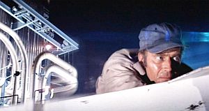 Jumping onto the roof of one of the trucks, Thorn is following the bodies and he soon arrives at a factory-like setting.