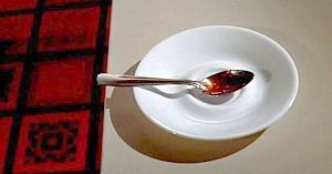 On his way out, Thorn pockets Martha's spoon.