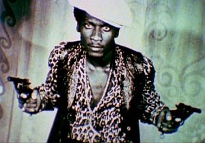 Promotional photo from “The Harder They Come” with Jimmy Cliff featured as pistol-packing Ivanhoe Martin.