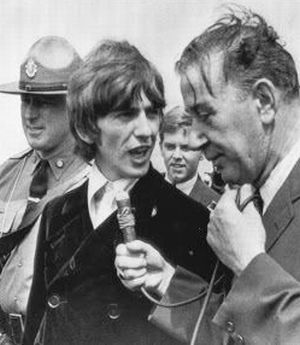 August 11th, 1966: Beatle George Harrison quizzed by reporter on tarmac at Boston’s Logan Airport as Beatles made connecting flight to Chicago to begin their American concert tour.