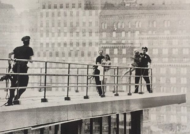 August 22, 1966: New York city police rescue two teenage girls on the 21st story of the Americana Hotel who threatened to jump 'unless we get to see the Beatles,' who were in the Warwick Hotel, a block away.  AP wire photo. 