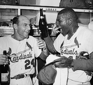 October 1964: St. Louis Cardinals shortstop Dick Groat and pitcher Bob Gibson celebrate the 1964 World Series championship. (Sports Illustrated photo).