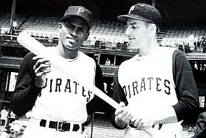 1960s: Pittsburgh Pirates Roberto Clemente and Dick Groat checking out the Pirate lumber. Click for signed photo.