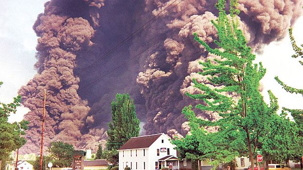 June 10, 1999. Smoke from pipeline explosion at Whatcom Creek in Bellingham, WA rises ominously after leaked  gasoline ignited, killing three boys. (Bellingham Herald ).