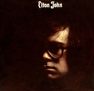 “Elton John” album cover of 1970. Click for album and/or digital singles, including “The Greatest Discovery”.