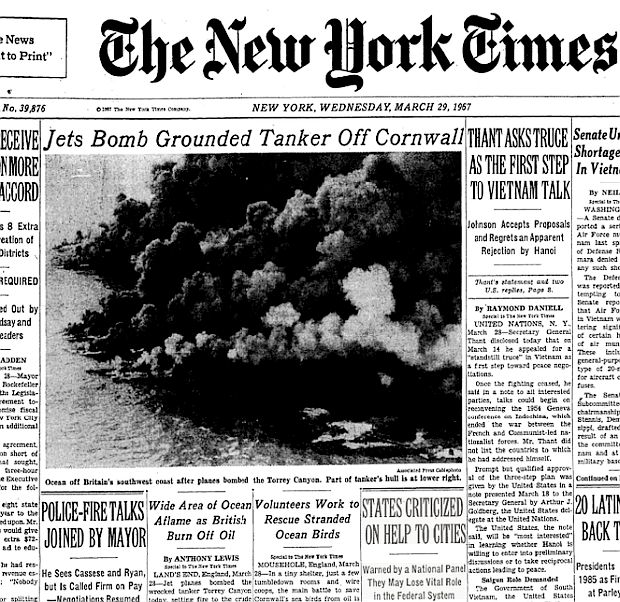 Portion of the front-page of the March 29th, 1967 New York Times, with headline, “Jets Bomb Grounded Tanker Off Cornwall,” with photo of the bombing, along with two stories about the spill below the photo – “Wide Area Of Ocean Aflame as British Burn Off Oil,” and, “Volunteers Work to Rescue Stranded Ocean Birds”.