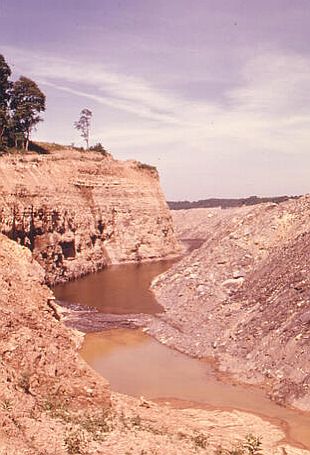 Ravaged landscape in Southeast Ohio with meandering highwall following strip mining there. 1974 photo, EPA/Erik Colonius.